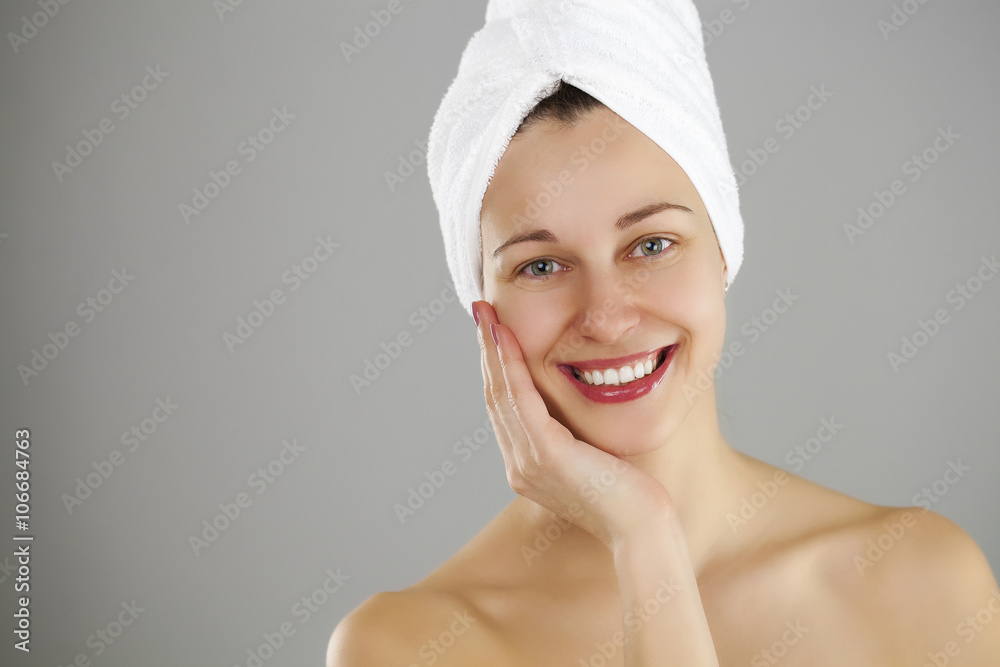 Beautiful young woman posing in white towel Beautiful young woman posing in white towel