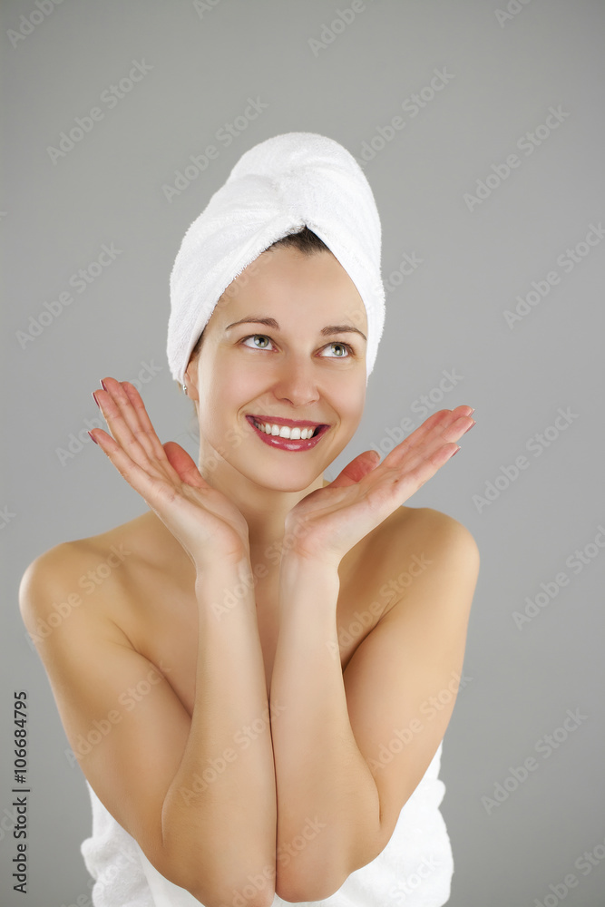 Beautiful young woman posing in white towel Beautiful young woman posing in white towel