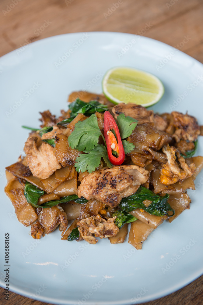 Asian stir fried flat rice noodles. Pad se ew with chicken