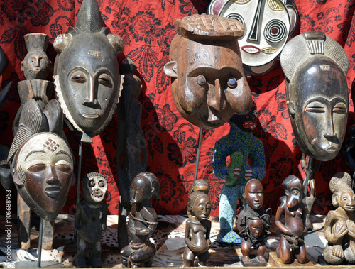 African masks and statues at a flea market