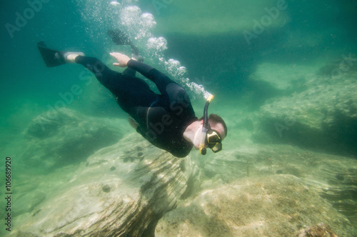 Free diver exploring sea bottom