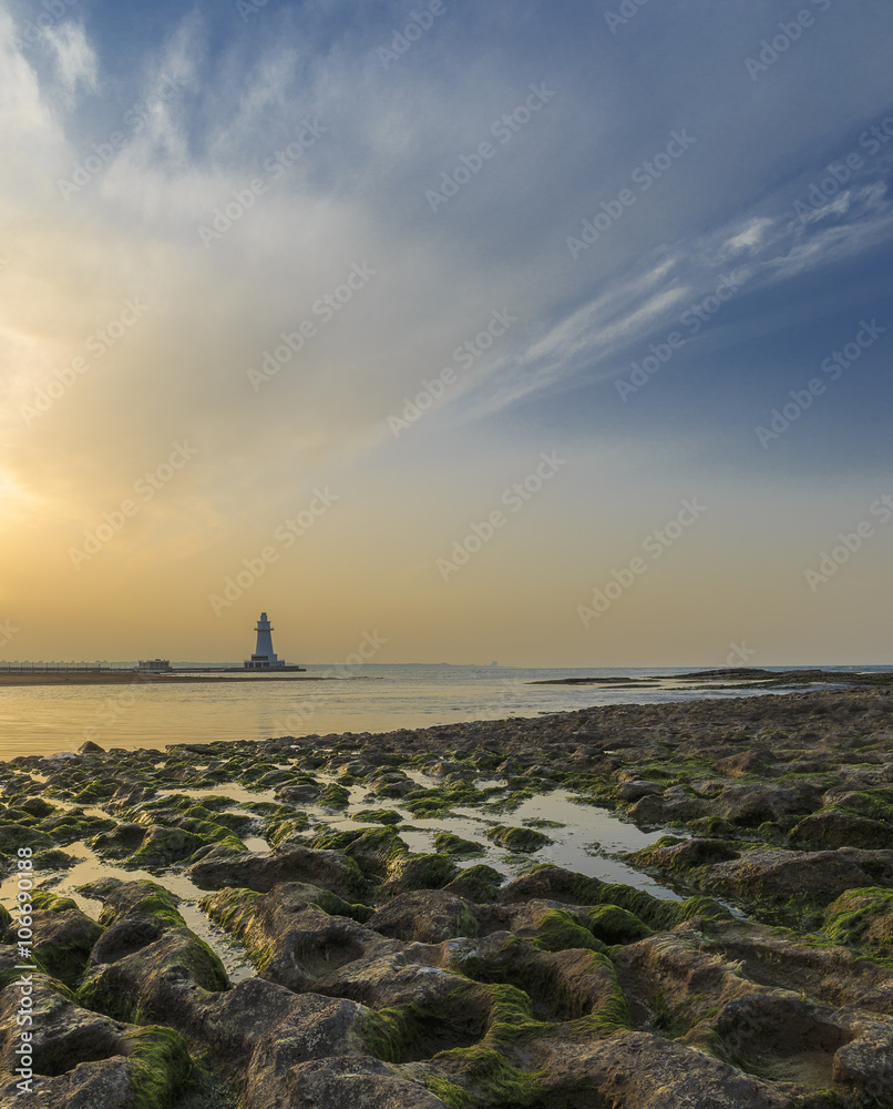 Lighthouse at sunset.The coast of the Caspian Sea.Azerbaijan