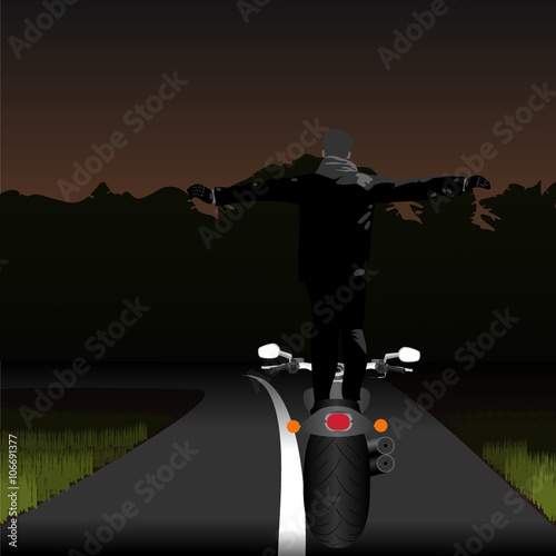 Staying on moto full height hands raising on night landscape