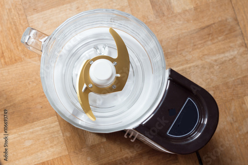 Food processor with gold blades taken from overhead perspective