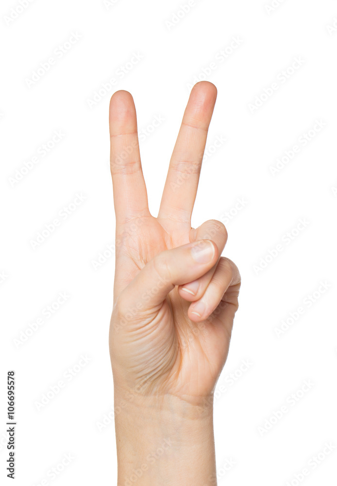 close up of hand showing peace or victory sign close up of hand showing peace or victory sign