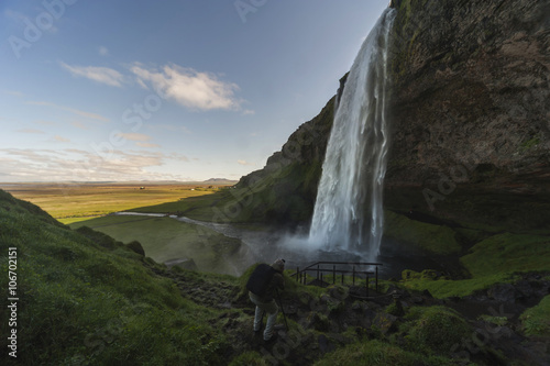 Iceland, Photographer shooting at Seljalandsfoss