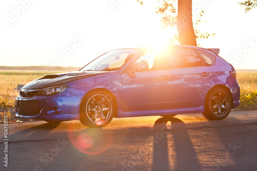 Left side view of blue sport car