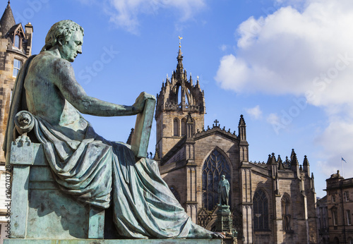 David Hume Statue and St Giles Cathedral in Edinburgh, Scotland. photo