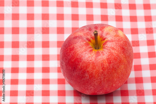 Red apple on table napkin