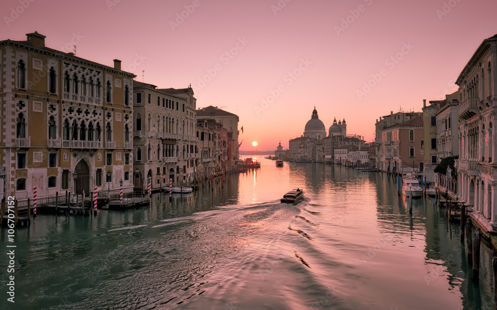 Water taxi at sunrise on Grand Canal in Venice