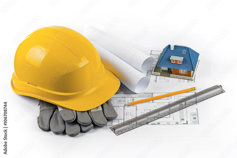 Fototapeta premium house construction project - tools and equipment on blueprints