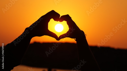 Sun in heart - Hand Heart Sunset, making heart shape
