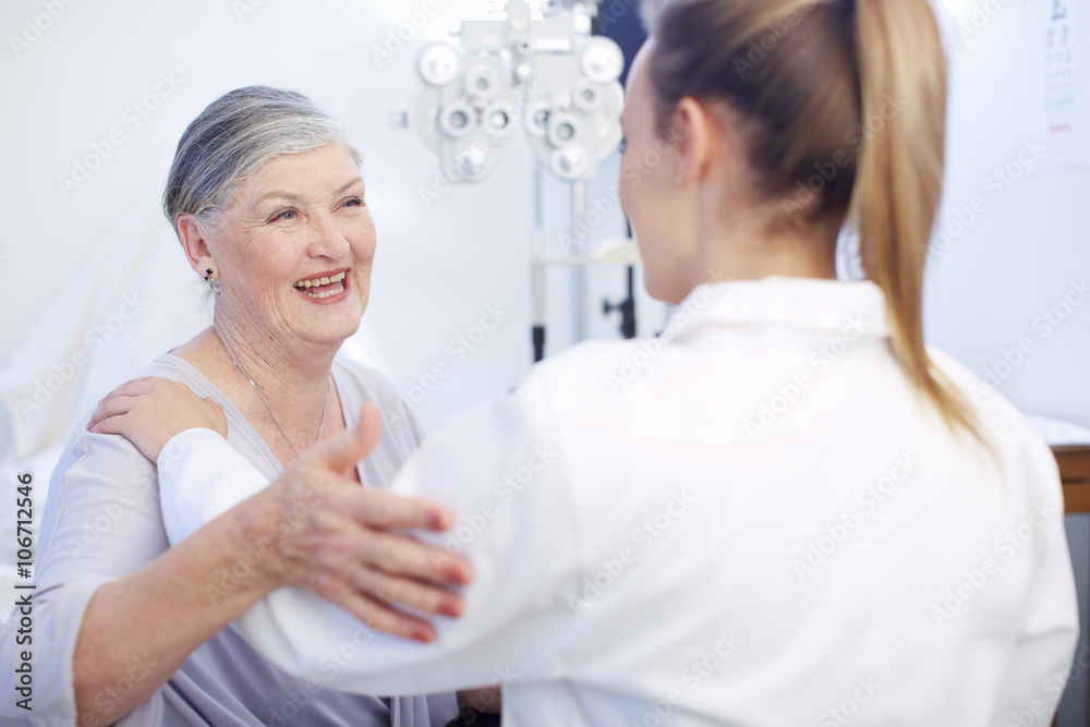 Smiling senior woman at the eye doctor