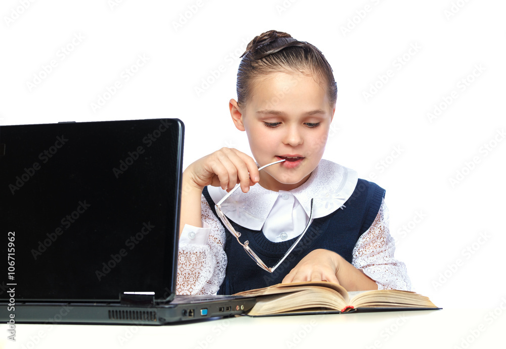 Portrait of a schoolgirl who does their homework, watch glasses Portrait of a schoolgirl who does their homework, watch glasses