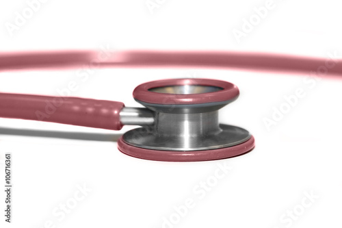 red stethoscope on white background