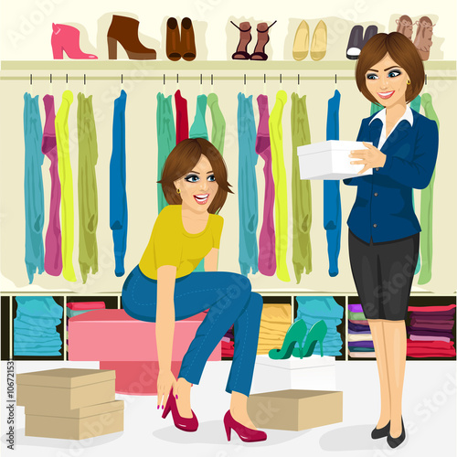 young woman trying on different shoes with help of shoe store assistant