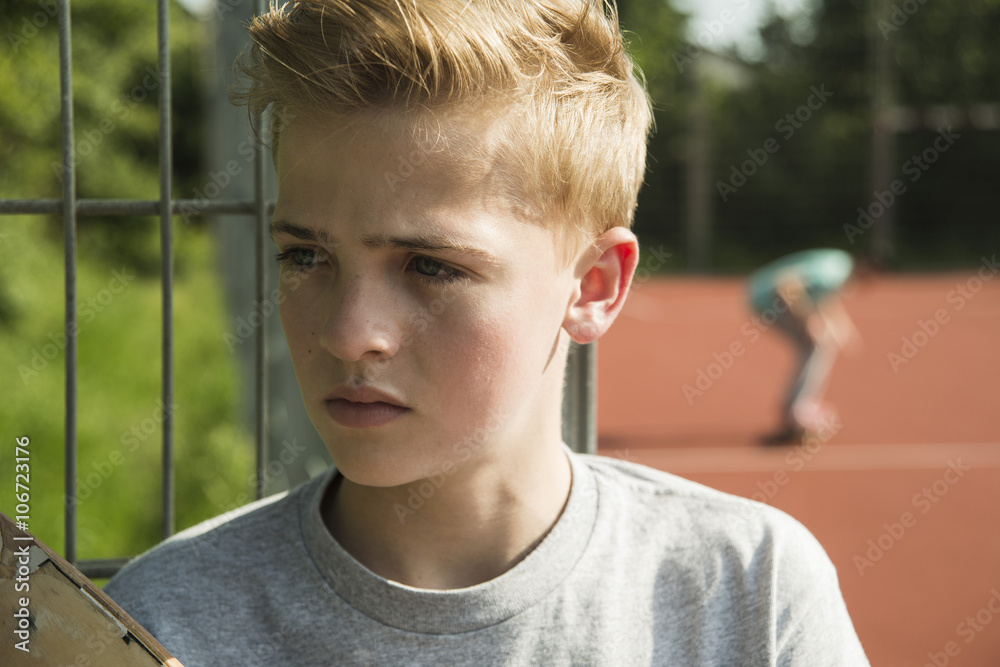 Portrait of serious teenage boy outdoors Portrait of serious teenage boy outdoors