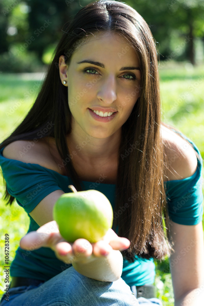 Young happy smiling woman with apple Young happy smiling woman with apple