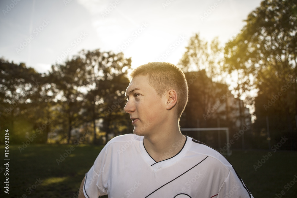 Teenager on soccer pitch looking around Teenager on soccer pitch looking around