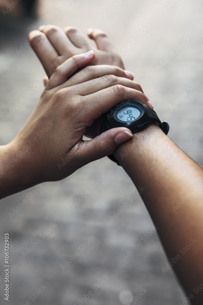 Arms of young woman with wrist watch, close-up