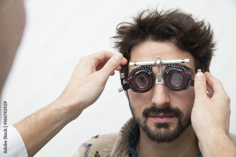 Man at the optometrist making an eye test Man at the optometrist making an eye test