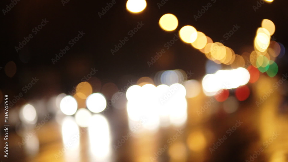 Diffused background with blurring lights of cars on the road of a big city.