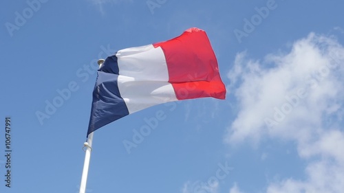 Flag of France in front of blue sky floating on flag pole slow motion 1080p FullHD footage - French tricolor flag waving 1920X1080 HD video photo