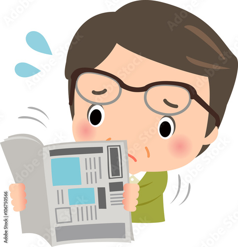 老眼の中年男性