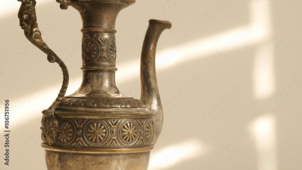 Old ancient jar made of brass on white surface slow tilting 4K 2160p UltraHD footage - Slow tilt on handmade brass object on white background 4K 3840X2160 UHD video Old ancient jar made of brass on white surface slow tilting 4K 2160p UltraHD footage - Slow tilt on handmade brass object on white background 4K 3840X2160 UHD video