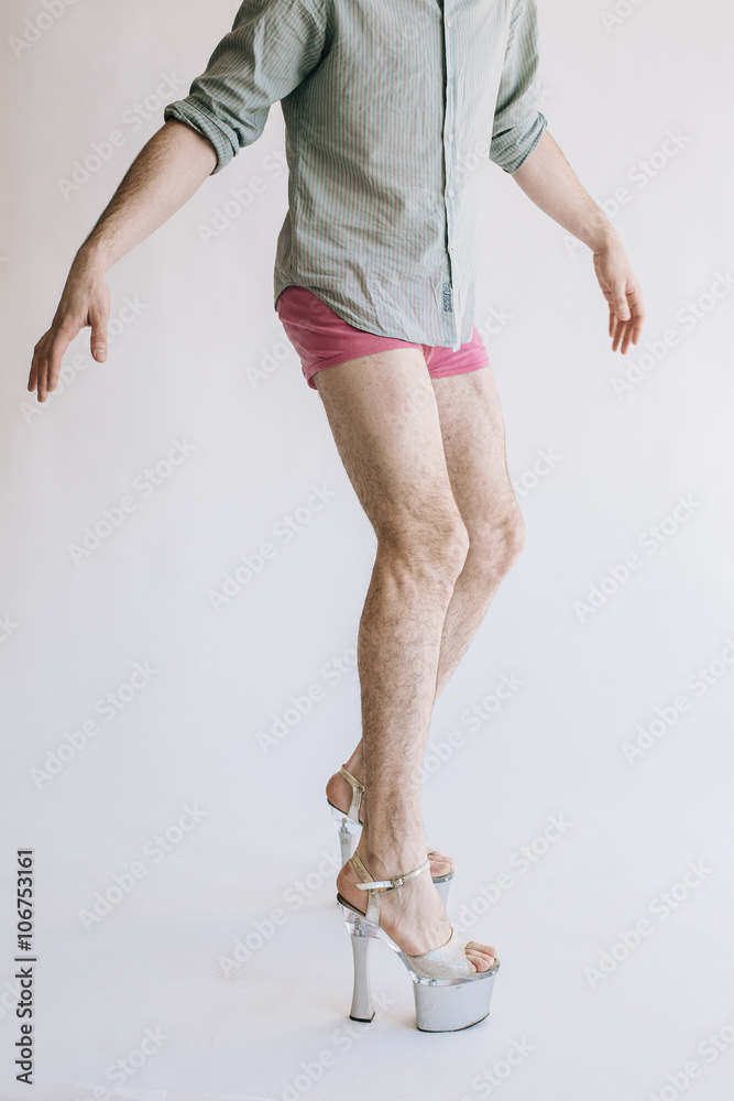 Hairy legs in high heels in pink panties isolated on white background  Stock-Foto | Adobe Stock