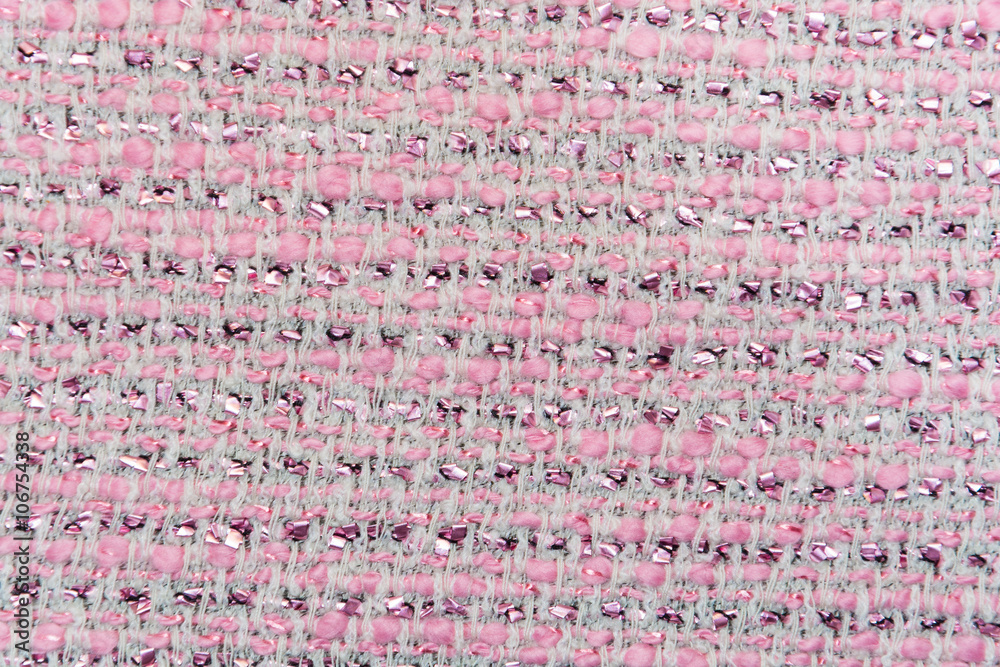 The background, texture of pink and white interwoven with lurex thread