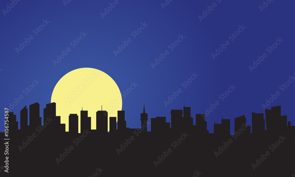 Silhouette of building and full moon