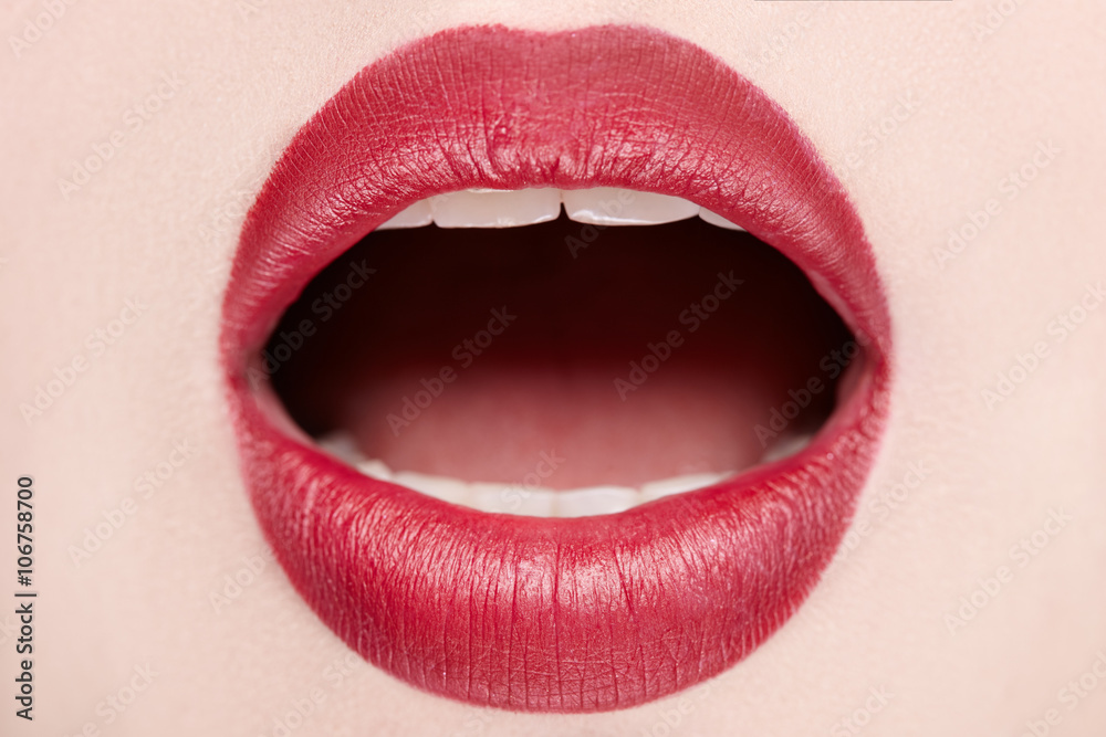 Foto Stock Close-up of open mouth woman with beautiful red lips | Adobe  Stock