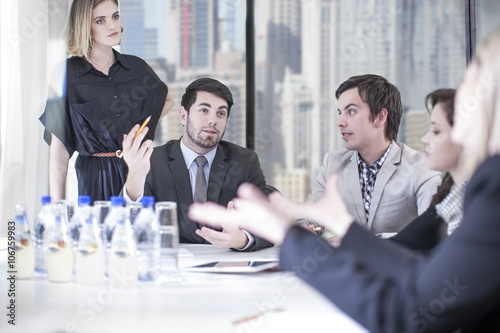 Business people discussing in boardroom photo