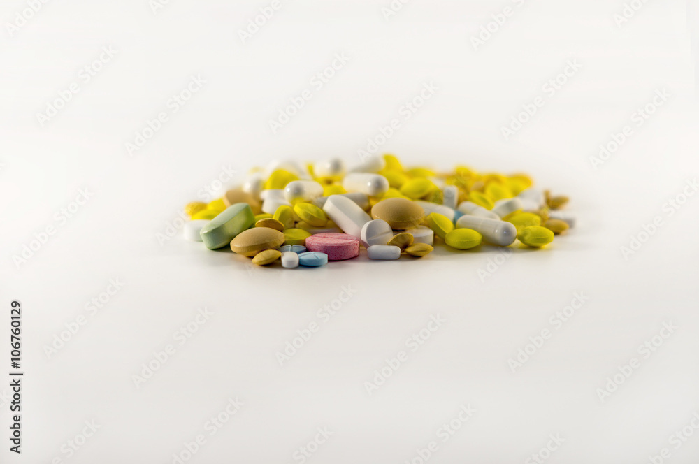 Pills scattered on a white background Pills scattered on a white background