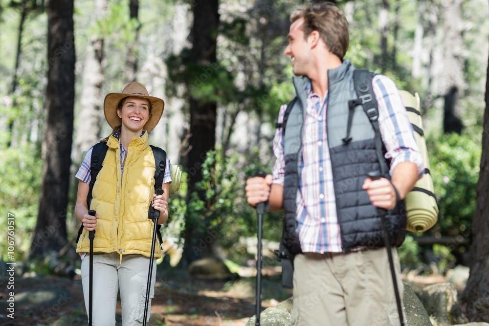 Happy man looking at smiling woman while hiking Happy man looking at smiling woman while hiking