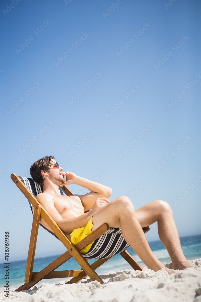 Man relaxing and using smartphone Man relaxing and using smartphone