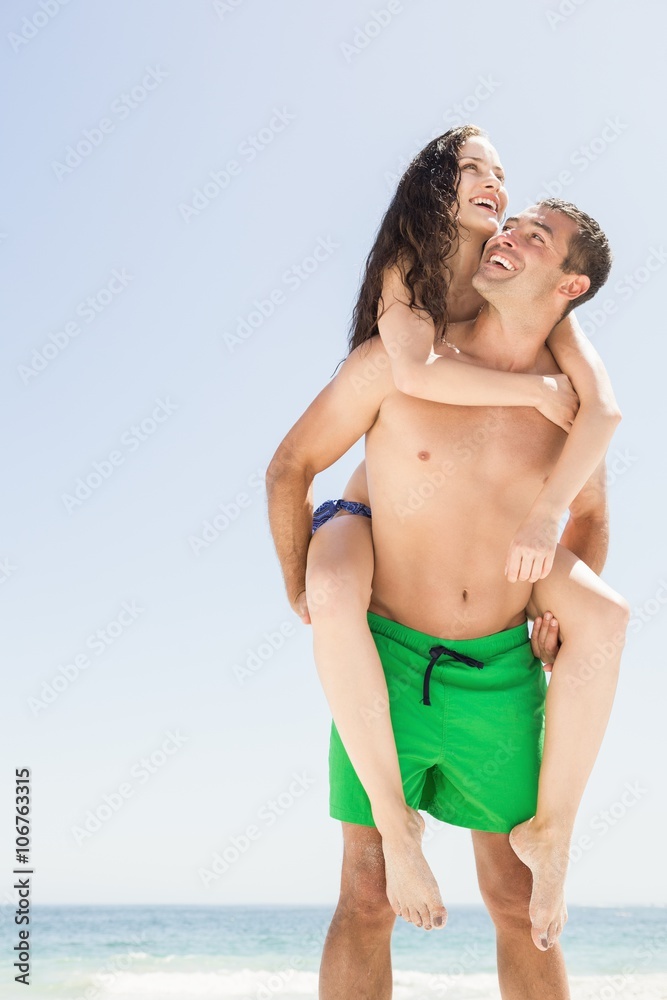 Boyfriend giving piggy back to girlfriend Boyfriend giving piggy back to girlfriend