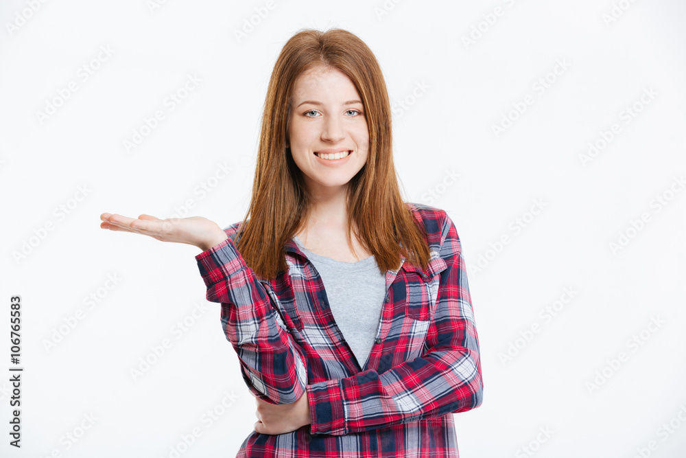 Smiling woman holding copyspace on the palm Smiling woman holding copyspace on the palm