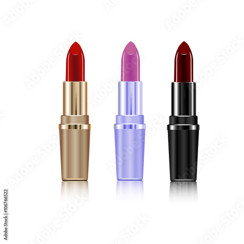 on a white background three golden isolated lipstick purple black