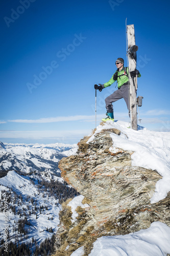 Austria, Grossarl, Filzmooshoerndl, man on mountain peak photo