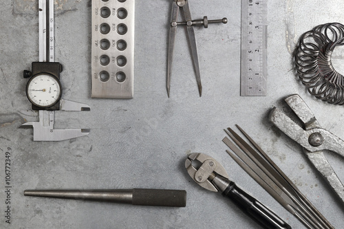 Tools set of jewellery. Jewelry workplace on metal background with copy space for text. Top view. photo