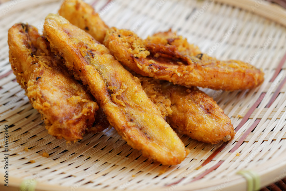 Close up of fried bananas on rattan tray. A traditional food in some places in south east asia Close up of fried bananas on rattan tray. A traditional food in some places in south east asia