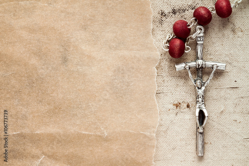 Catholic rosary and paper piece