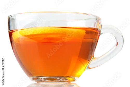 delicious green tea with a slice of lemon in transparent Cup on white isolated background