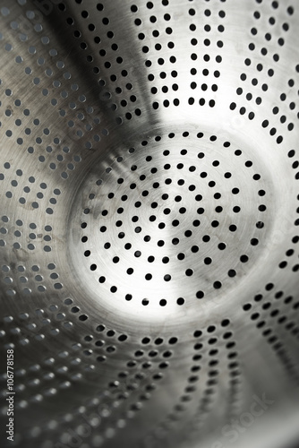 Tableau sur toile Metal colander background vertical