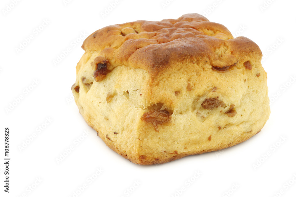 traditional english scone with raisins on a white background
traditional english scone with raisins on a white background