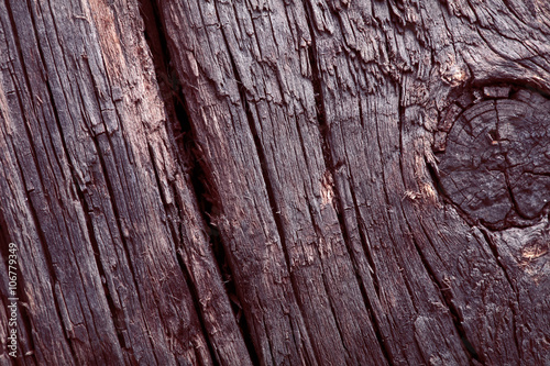 Fragment of an old knotty wooden planks