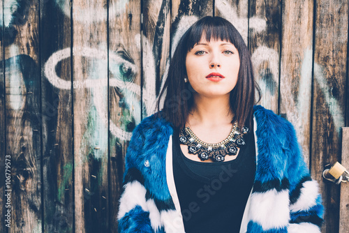 Half length of young beautiful eastern woman posing leaning agai