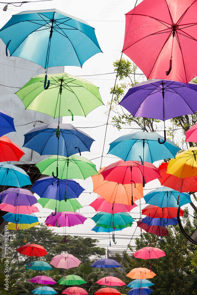 colorful umbrella hanging on the rope